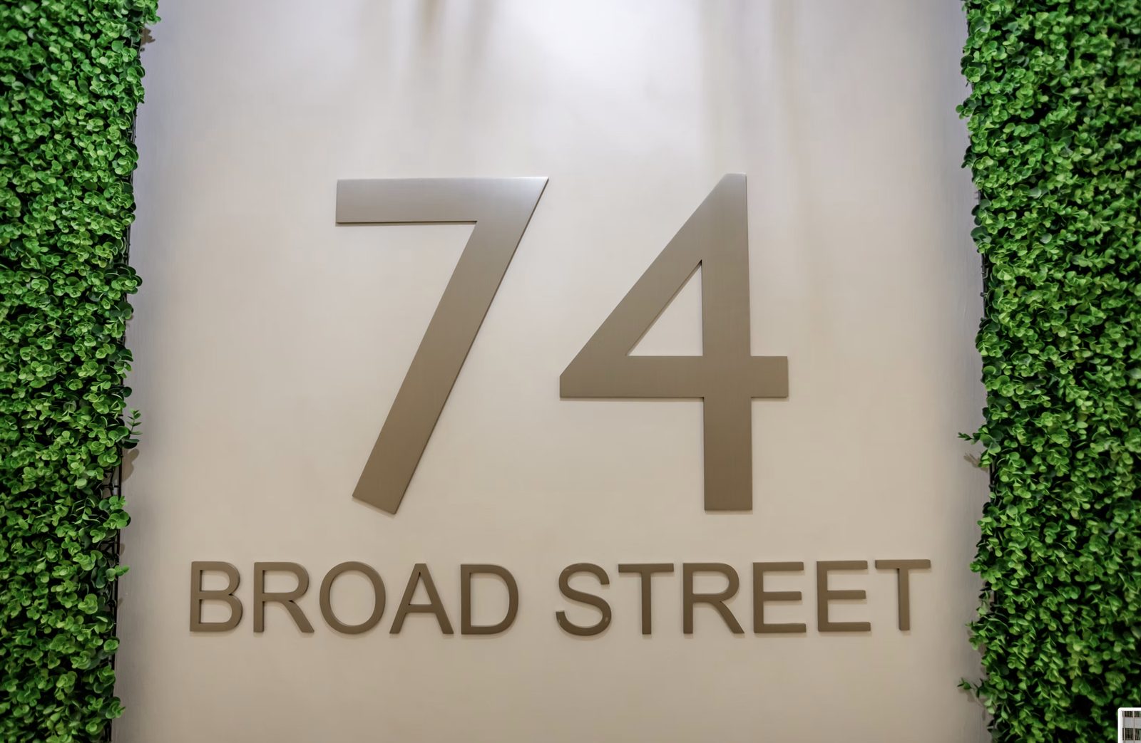 Building signage installation at 74 Broad Street commercial renovation
