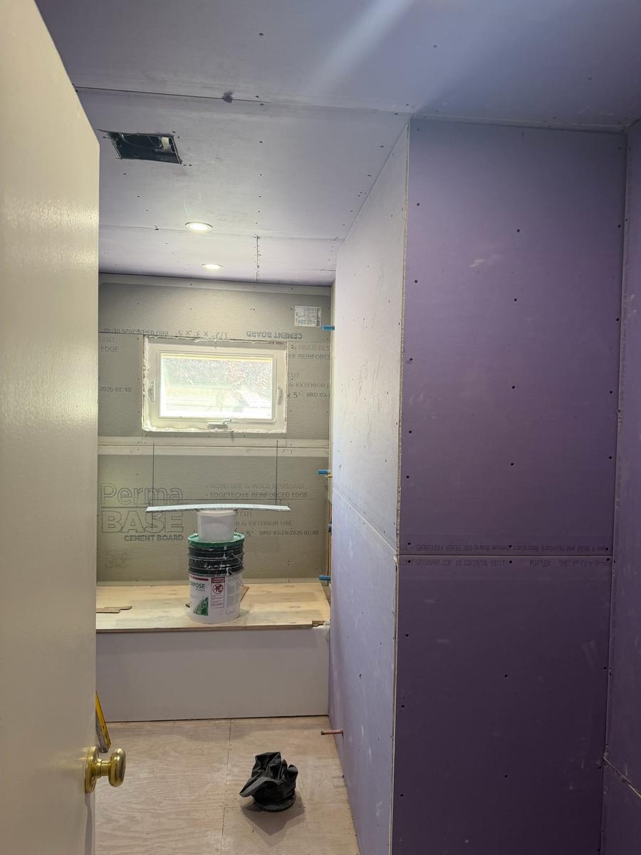 Cement board and moisture-resistant drywall installation