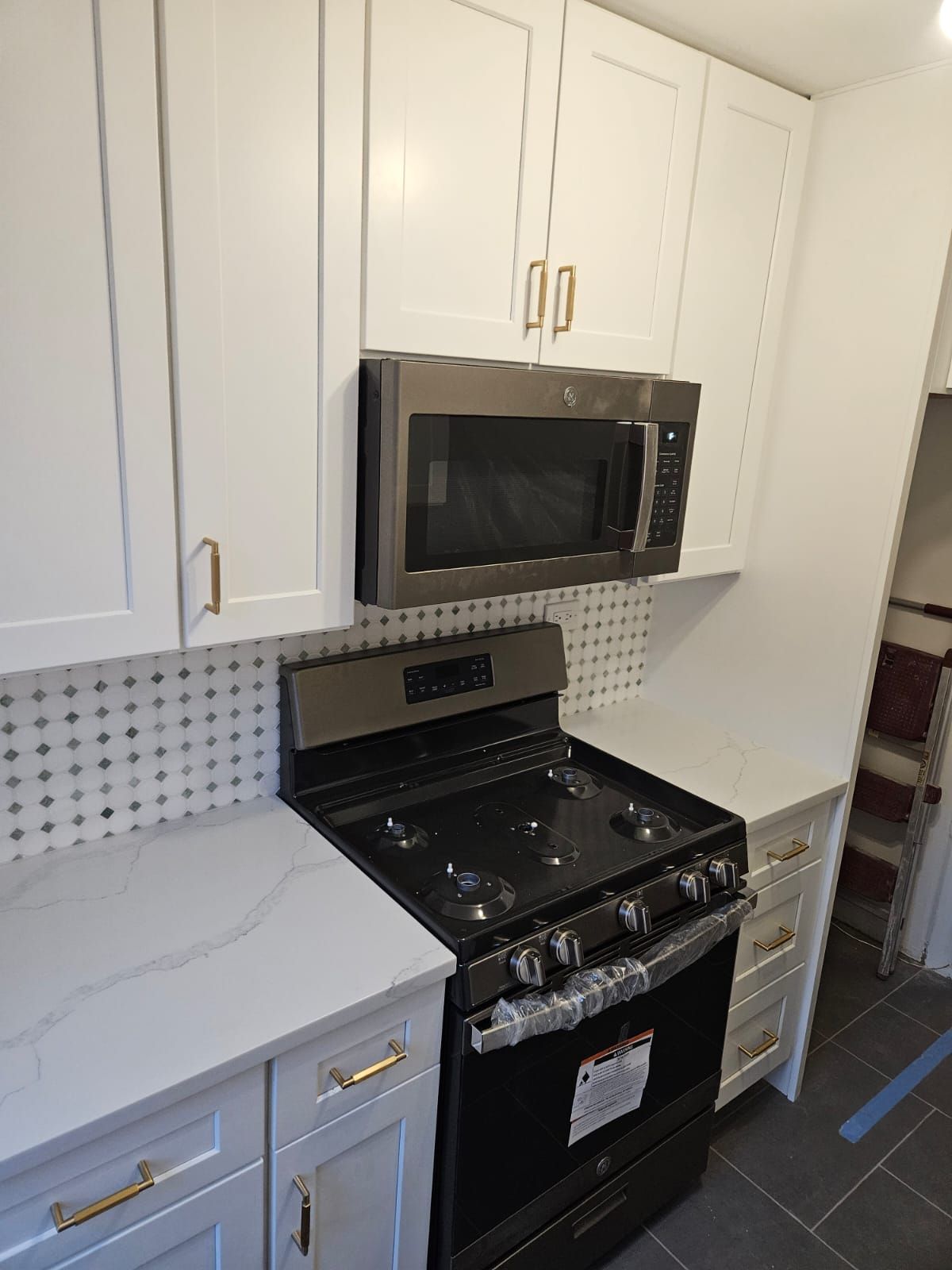 Built-in linen closet with custom oak shelving and display cubbies