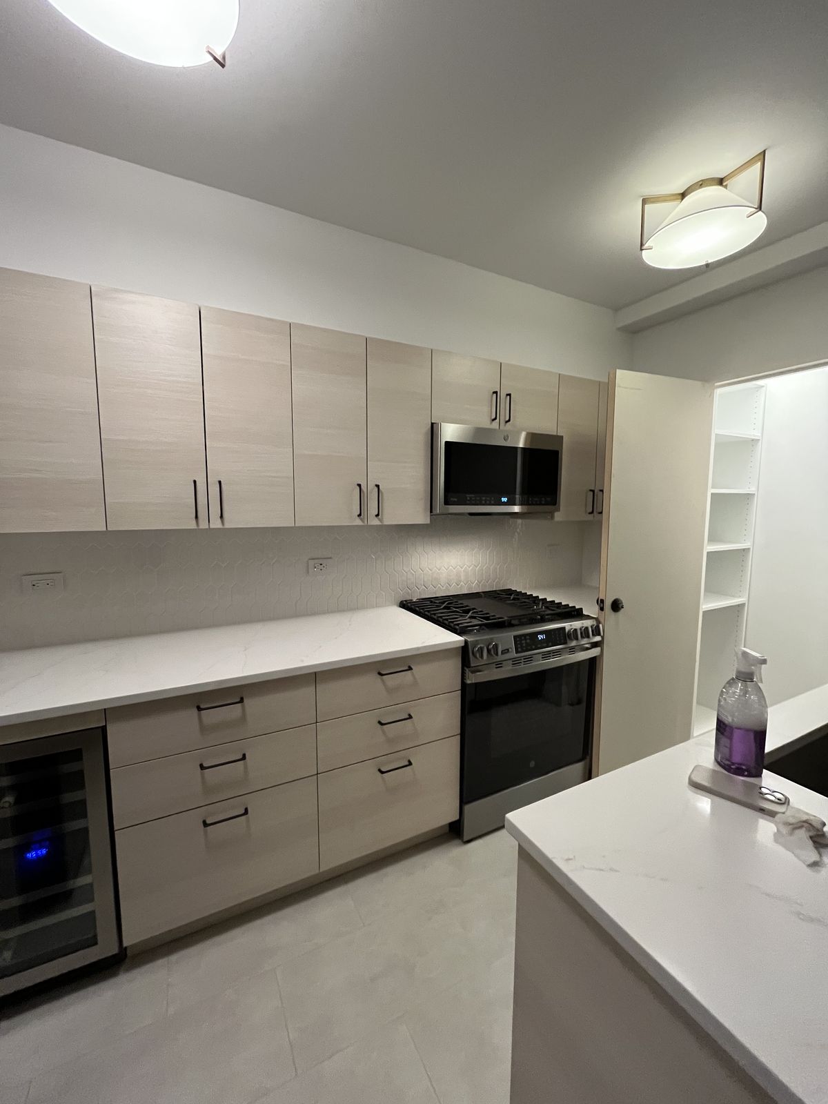 Built-in pantry with pull-out drawers and adjustable shelving