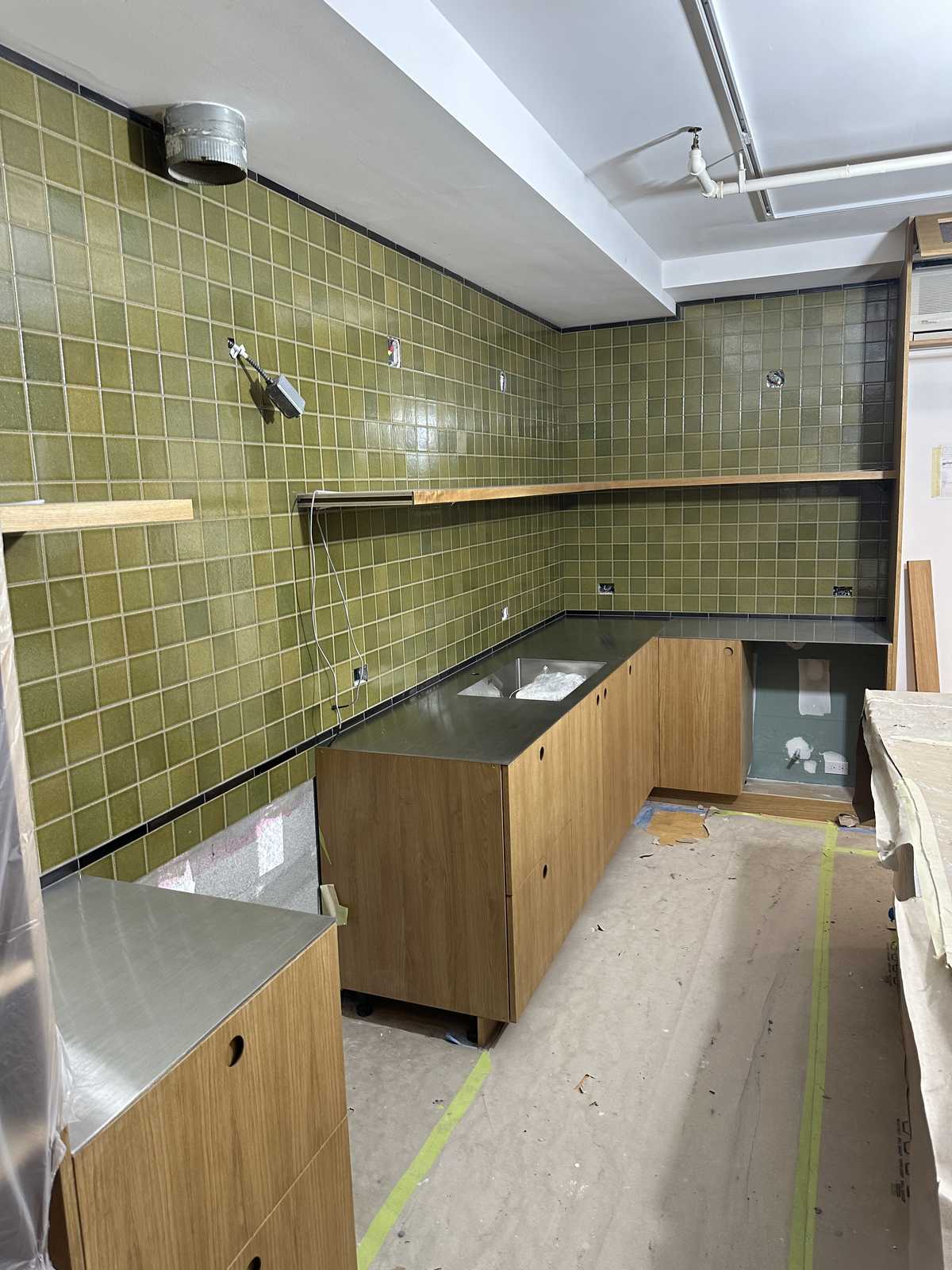 Walk-in closet with island dresser and LED under-shelf lighting