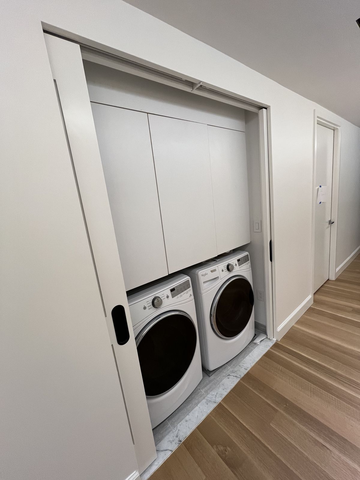 Custom mudroom lockers with bench, hooks, and overhead storage