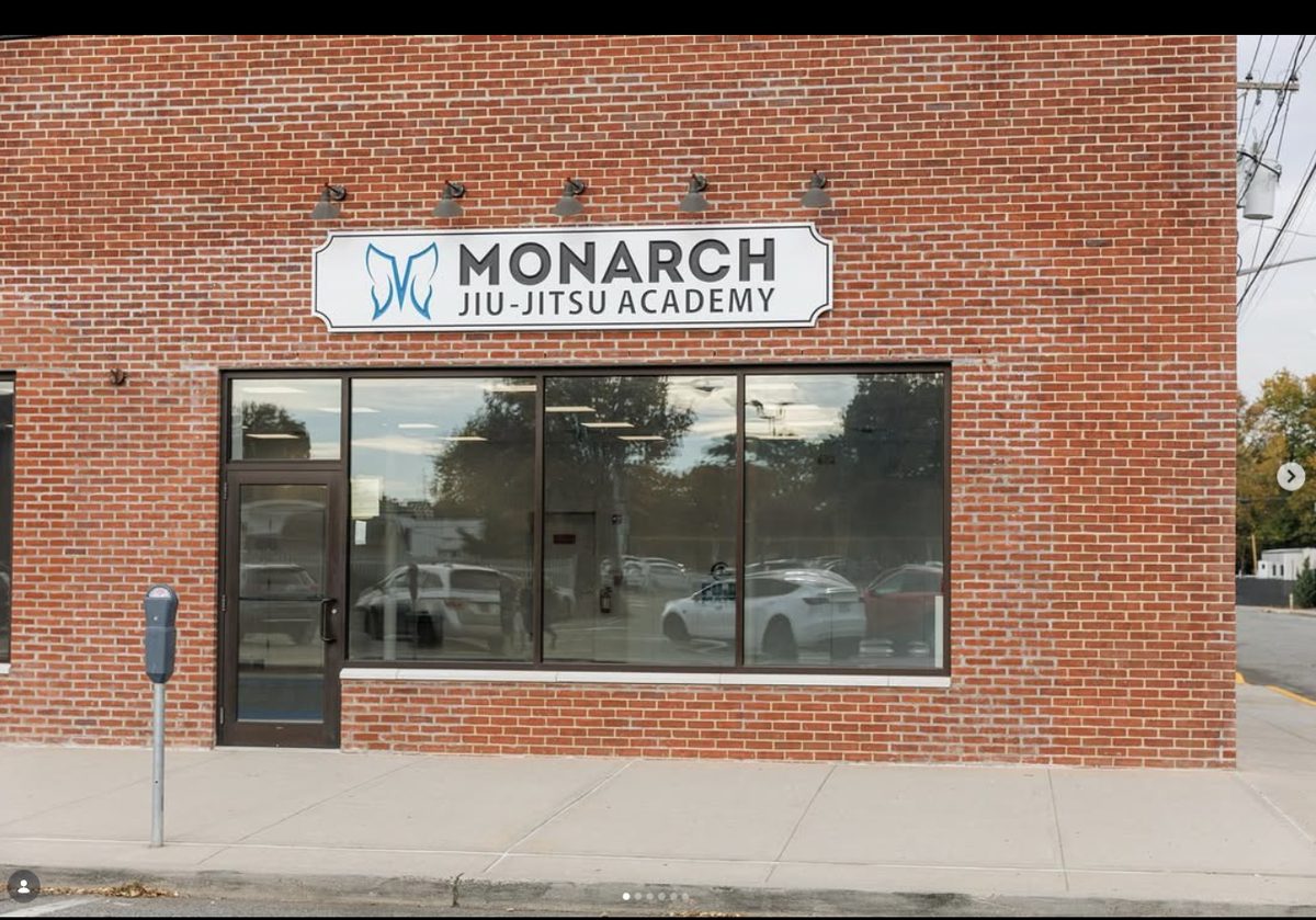 Commercial storefront buildout for fitness facility featuring custom signage and full glass facade