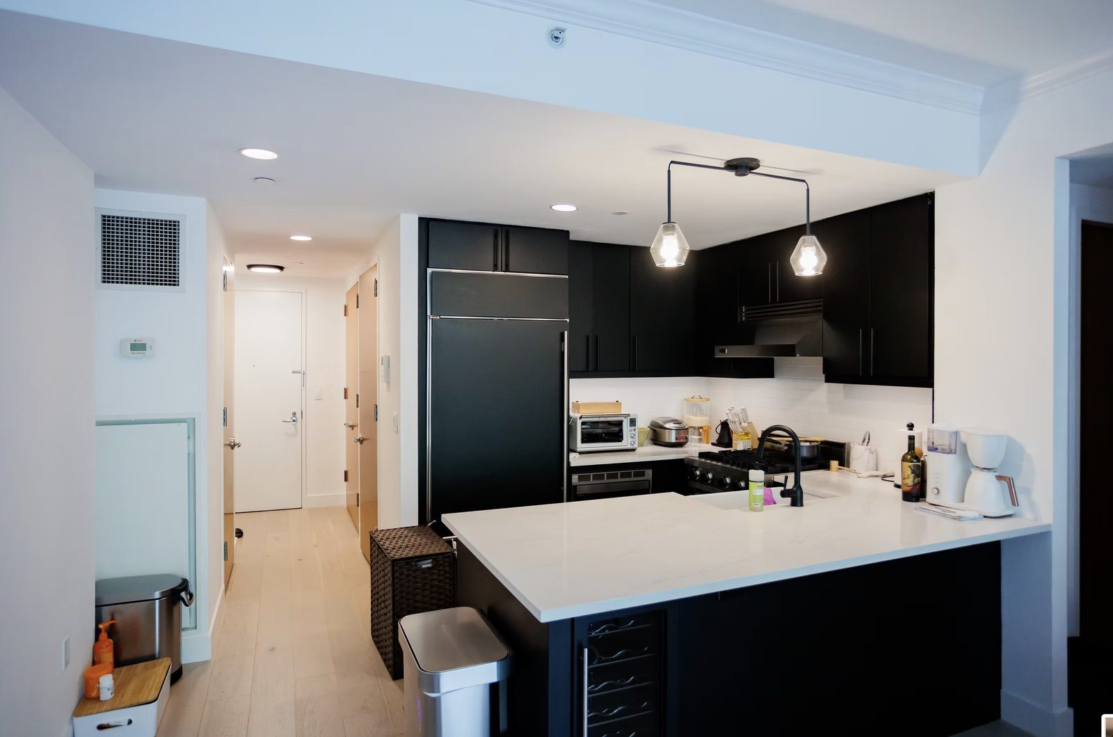 Modern kitchen with custom cabinets and stone countertops in Upper West Side gut renovation