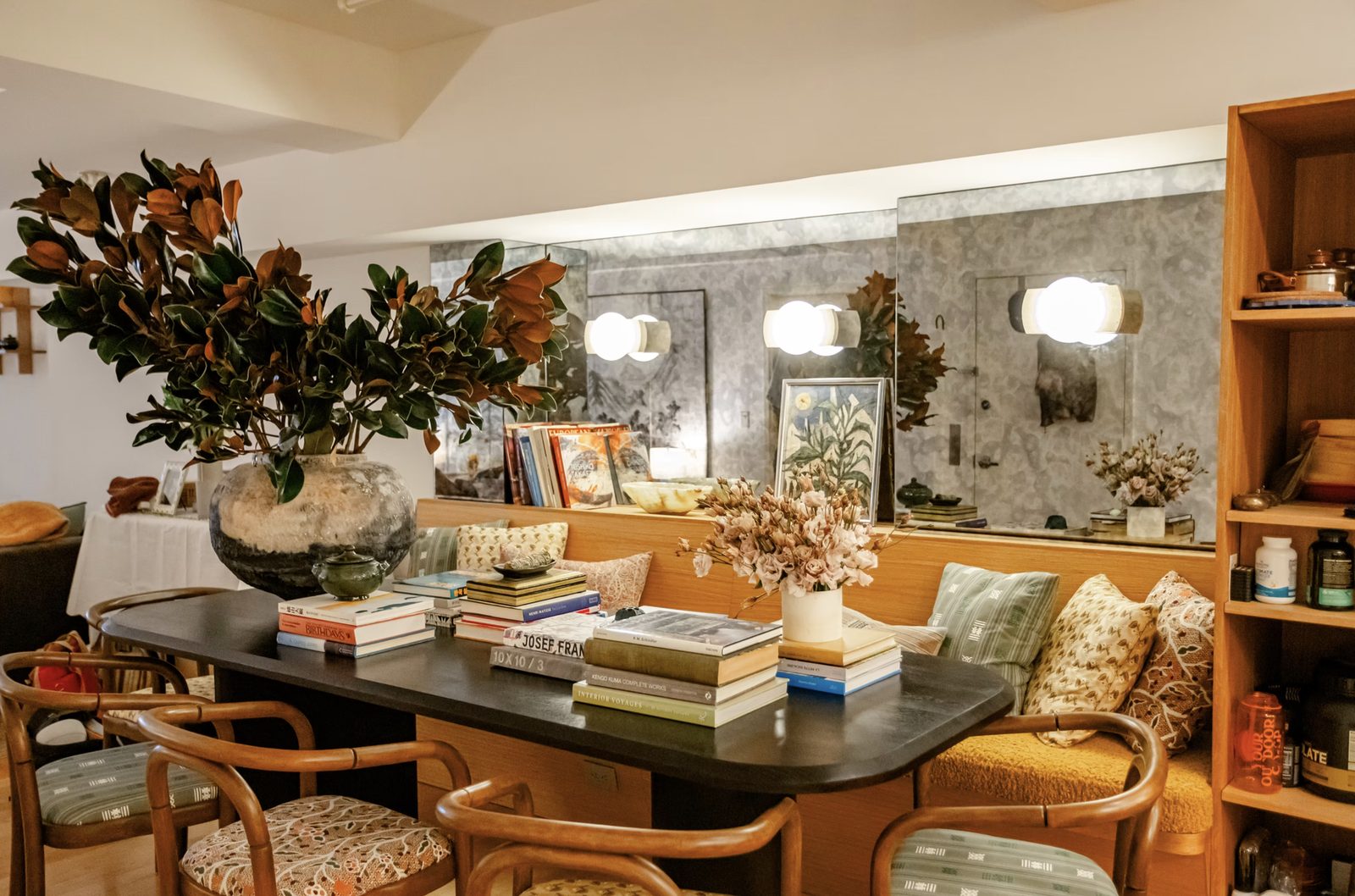 Open-plan dining area in luxury Nolita loft renovation with exposed architectural details