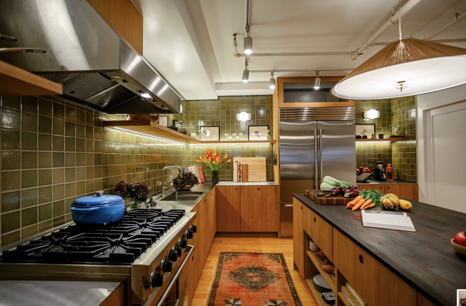 Custom kitchen renovation with quartz countertops, shaker cabinets, and subway tile backsplash in Nolita loft