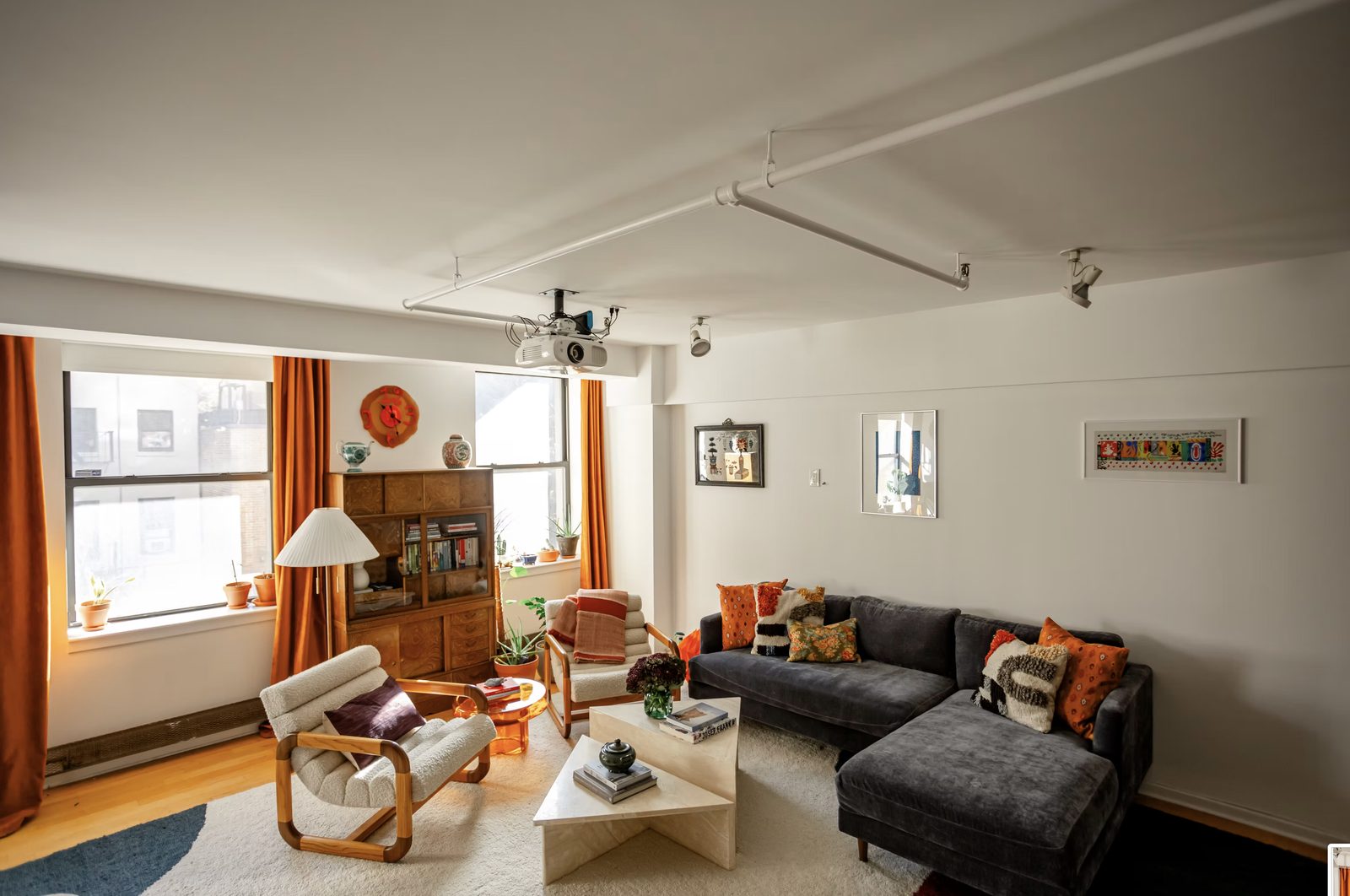 Living room with refinished hardwood floors and custom built-ins in Nolita loft renovation