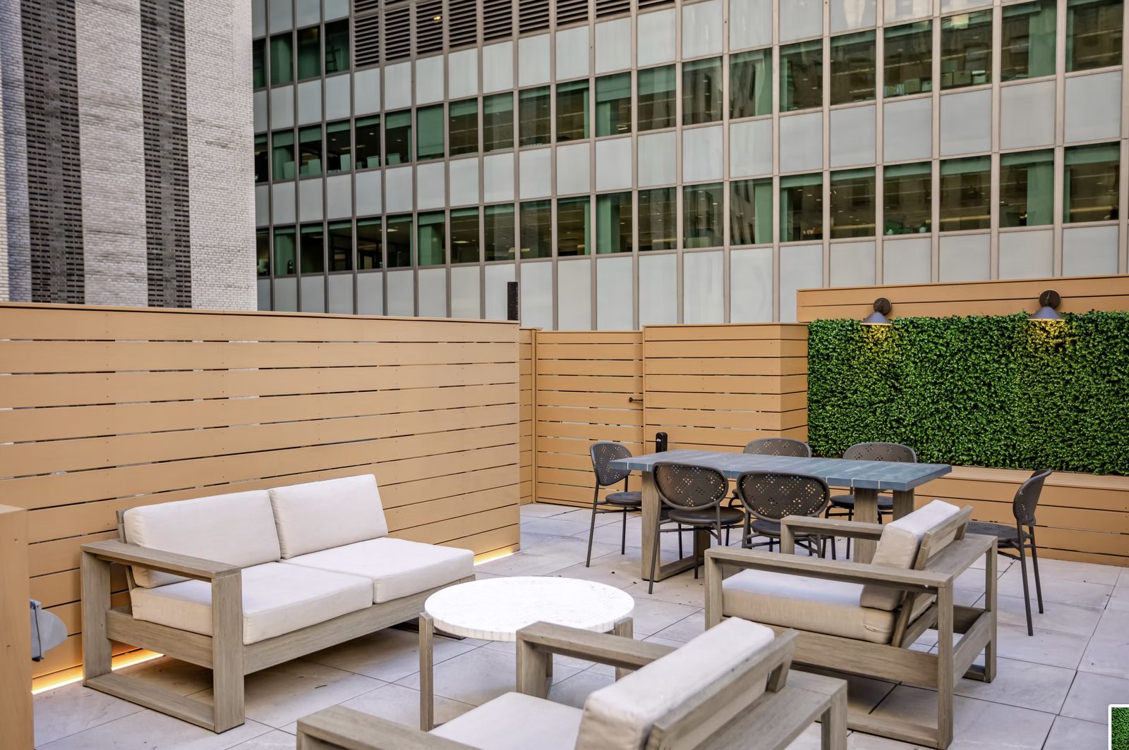 Rooftop terrace lounge area with custom seating and city views in NYC