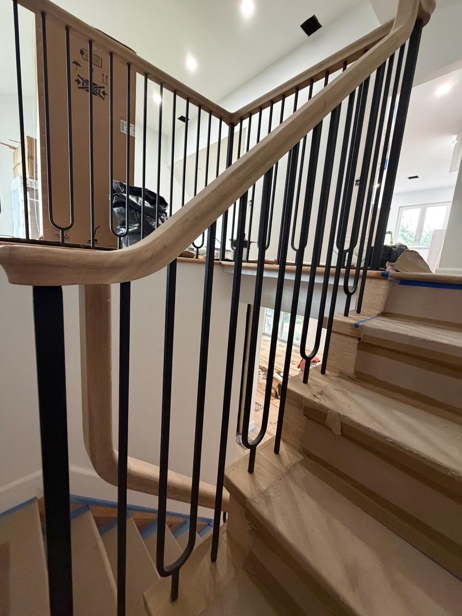 Iron balusters with oak railing from staircase landing