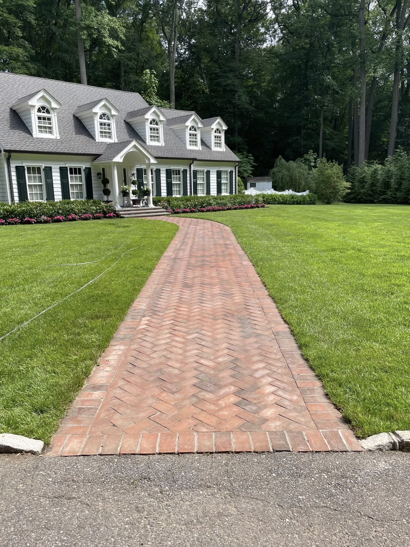 Brick walkway and landscaping at residential estate renovation in Lattingtown