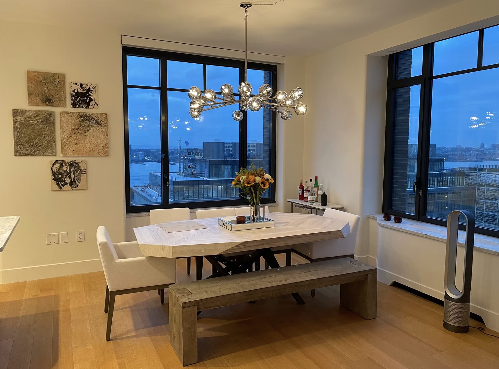 Dining room with city views in two-bedroom Hudson Square apartment renovation